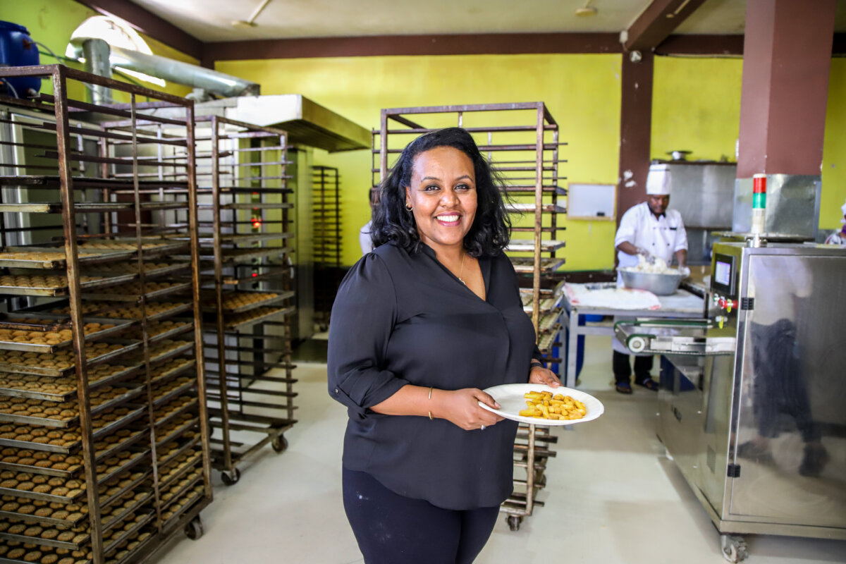 Ethiopian entrepreneur posing with plate