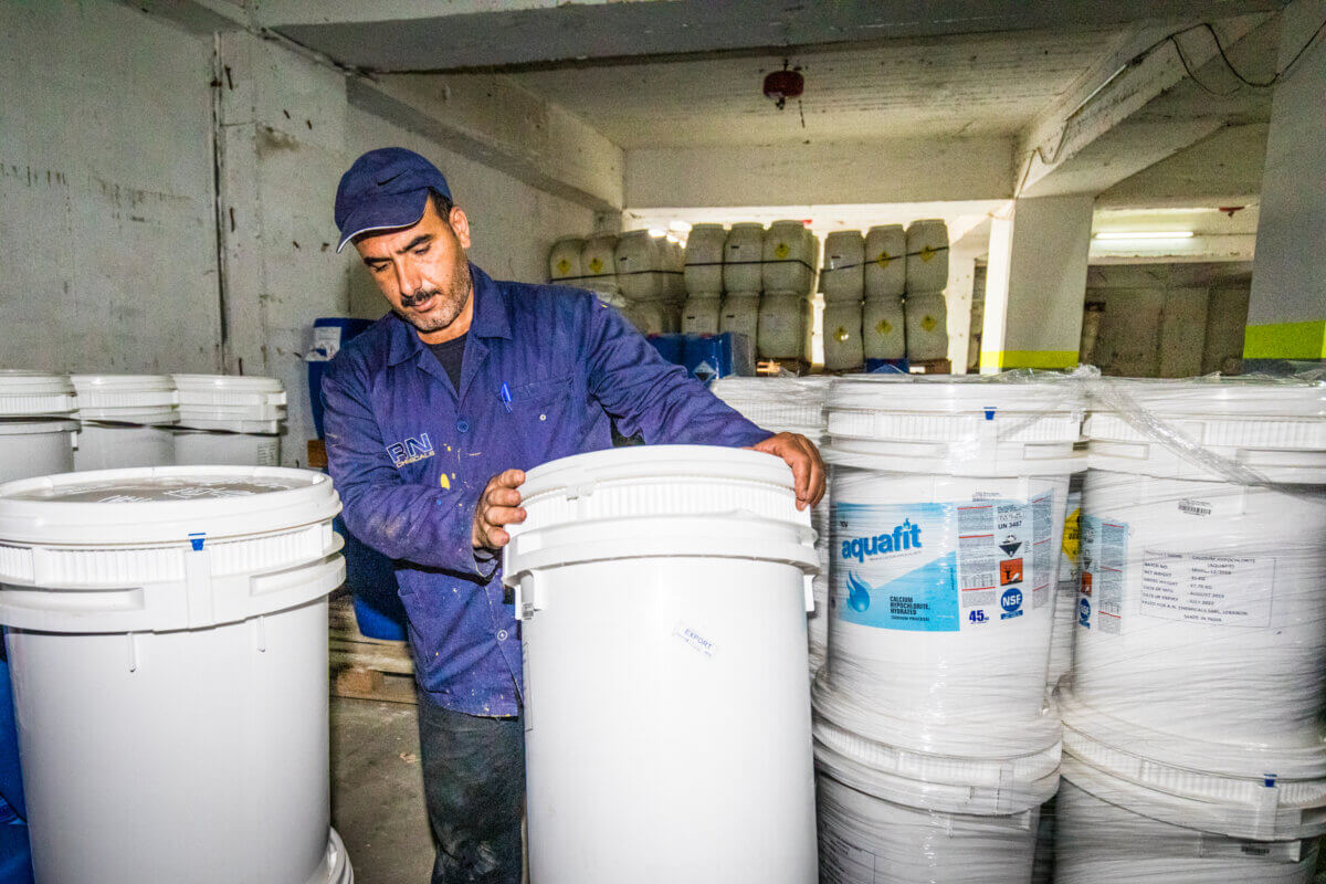 Employee with buckets